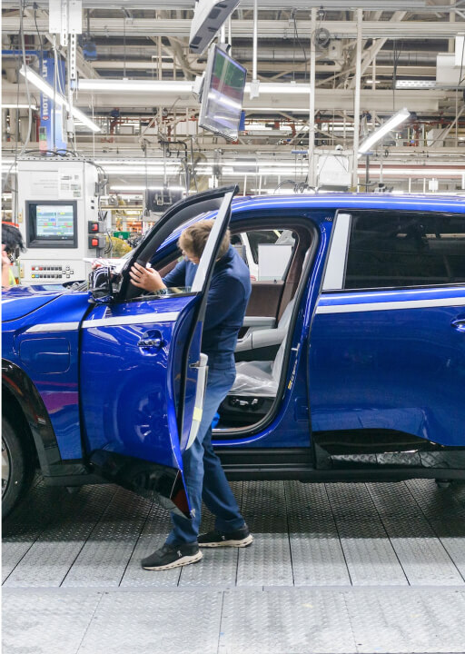 assembly worker working on suv
